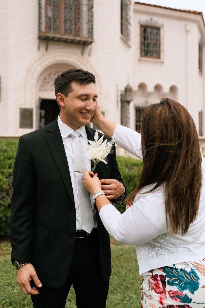 Museum Microwedding at the Mcnay Art Museum. Groom getting ready.