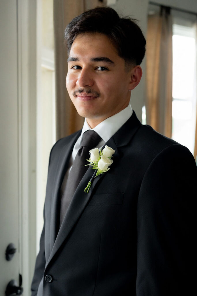 Groom getting ready portrait at Villa Antonia Austin Hill Country wedding