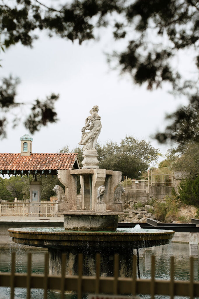 Villa Antonia wedding venue exterior with Mediterranean stone arches and Hill Country views in Jonestown Texas
