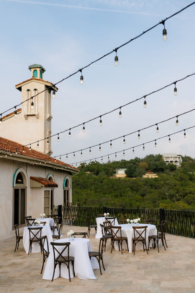 Villa Antonia wedding venue exterior with Mediterranean stone arches and Hill Country views in Jonestown Texas