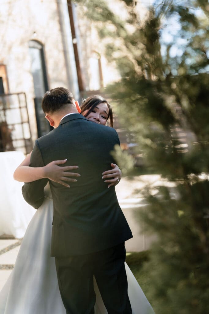 Romantic first look between bride and groom at One Eleven East wedding venue in Hutto Texas, captured by Andrea Jang Photography