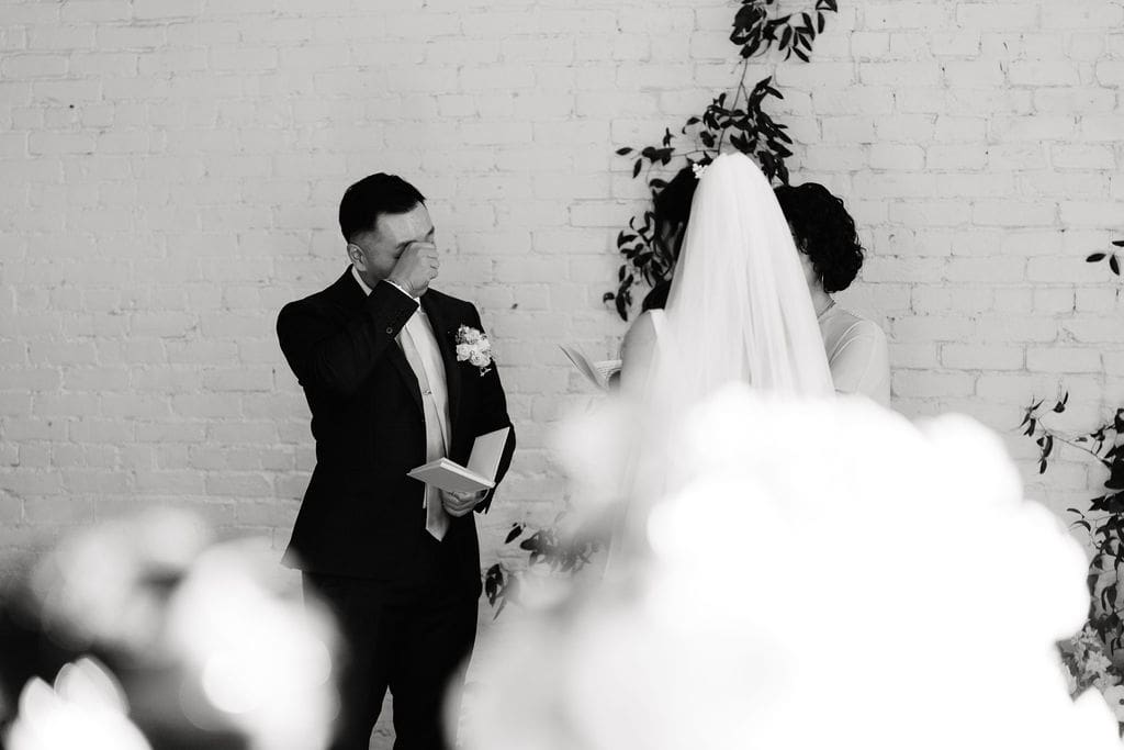 Tearful wedding vows at One Eleven East winter wedding in Hutto Texas, photography by Andrea Jang