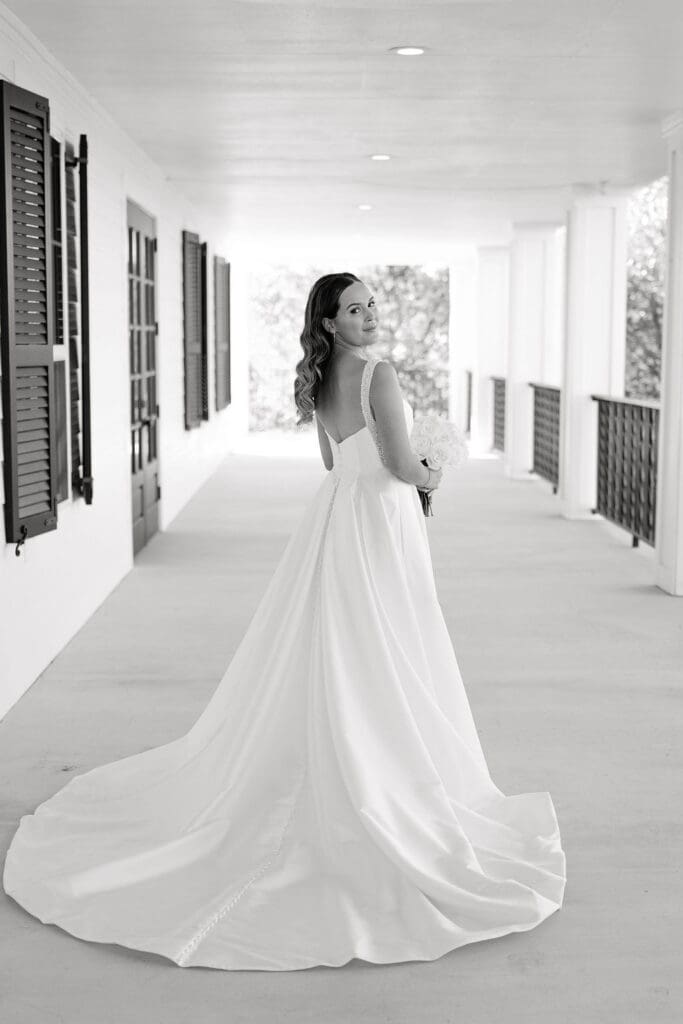Bride in wedding gown holding bouquet at Kendall Point Boerne TX