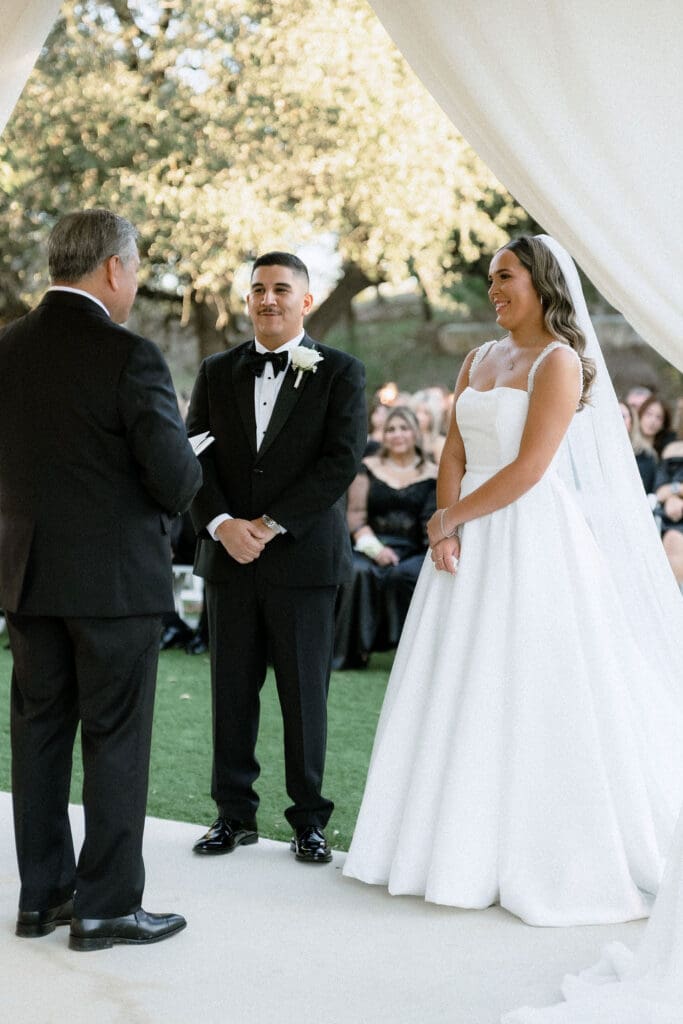 Bride and groom exchanging vows at Kendall Point Boerne Texas