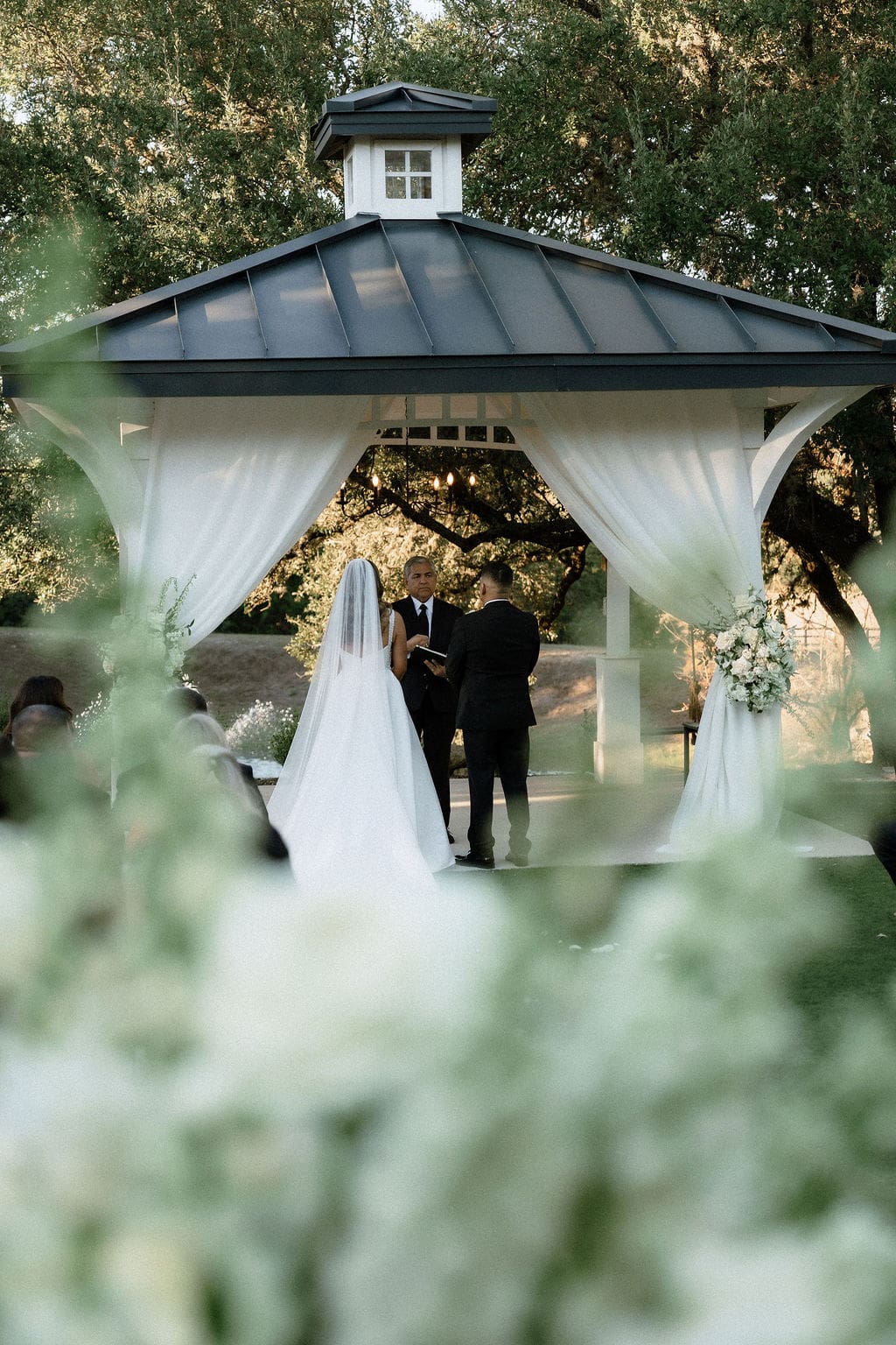 Bride and groom exchanging vows at Kendall Point Boerne Texas