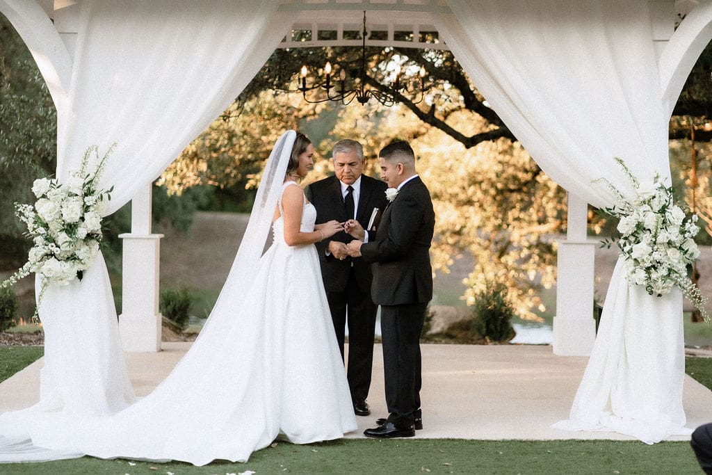 Bride and groom exchanging vows at Kendall Point Boerne Texas
