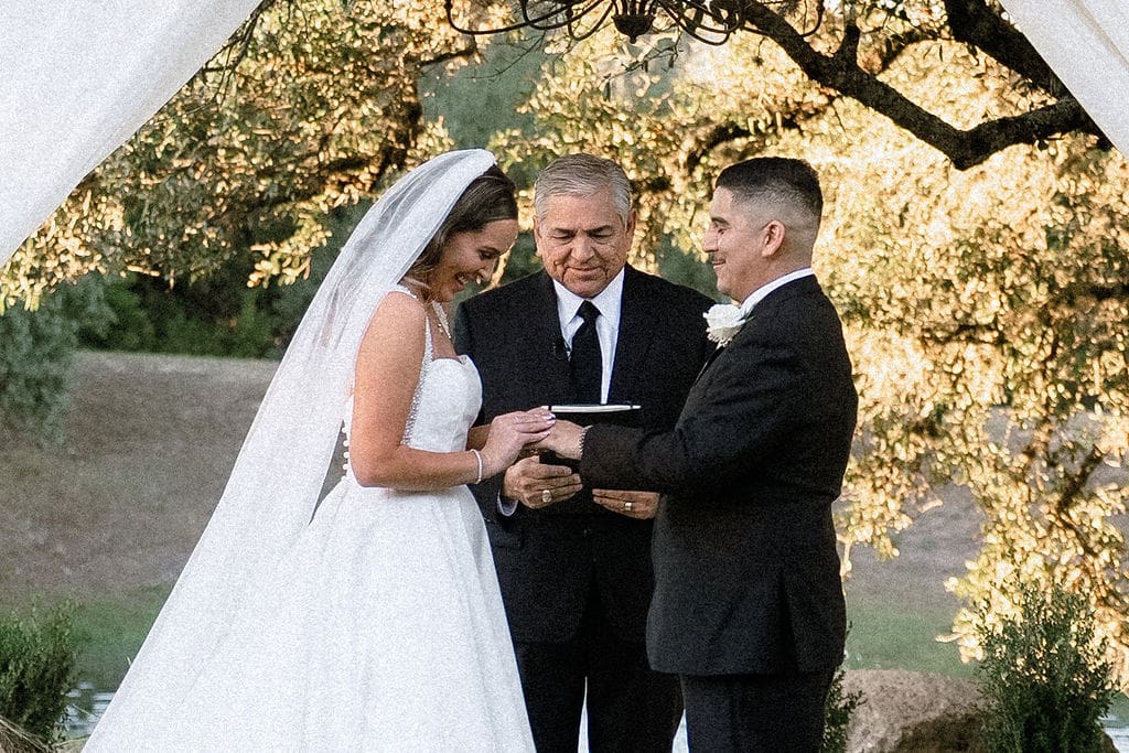 Bride and groom exchanging vows at Kendall Point Boerne Texas