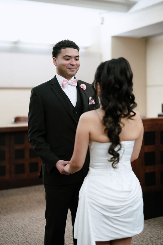 Couple exchanging vows during civil ceremony at Judge Helen Petry Stowe Courthouse 1 San Antonio