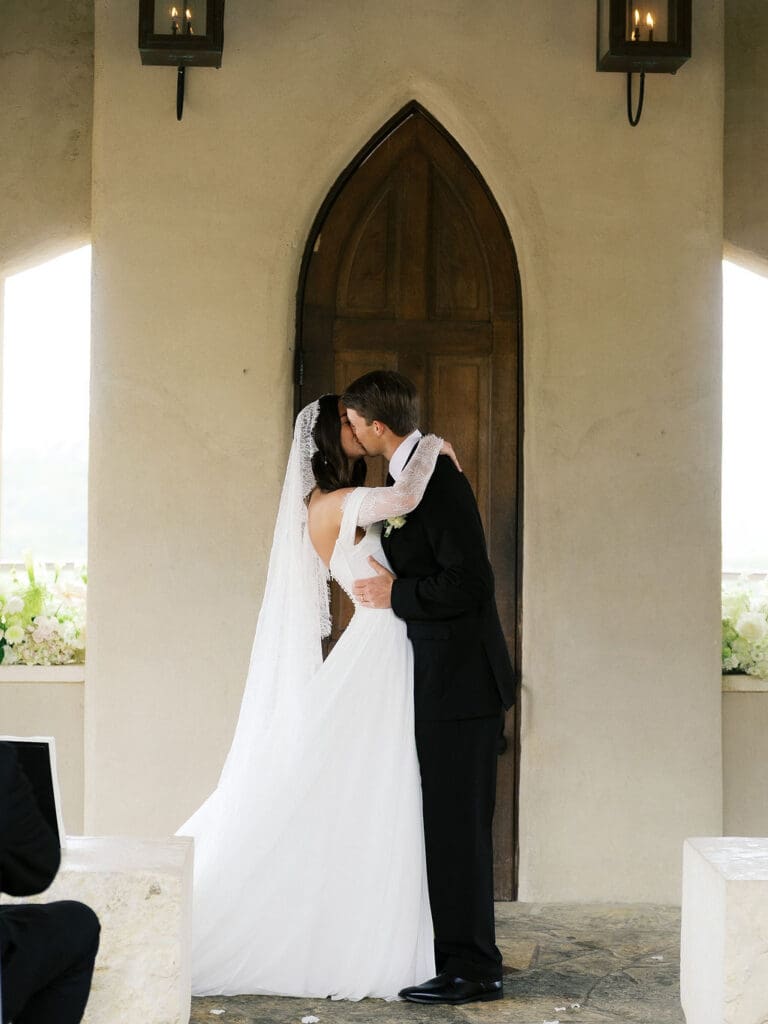 Bride and groom romantic rainy day wedding portraits at Chapel Dulcinea Austin Texas