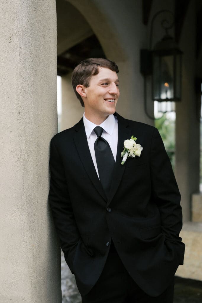 Groom romantic rainy day wedding portraits at Chapel Dulcinea Austin Texas