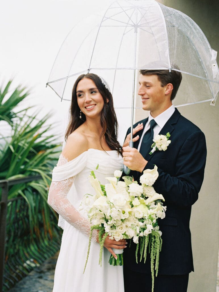 Bride and groom romantic rainy day wedding portraits at Chapel Dulcinea Austin Texas
