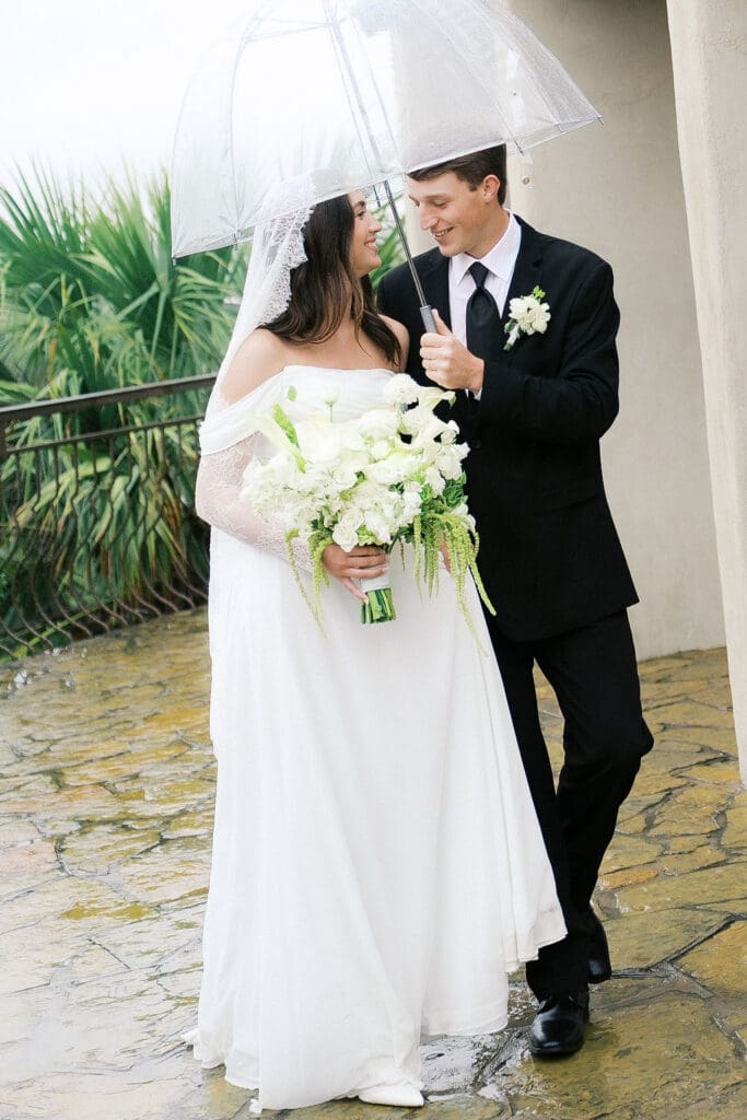Bride and groom romantic rainy day wedding portraits at Chapel Dulcinea Austin Texas