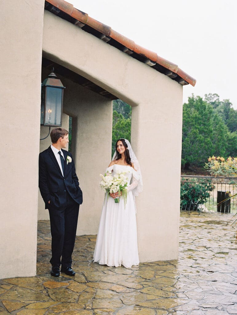 Bride and groom romantic rainy day wedding portraits at Chapel Dulcinea Austin Texas