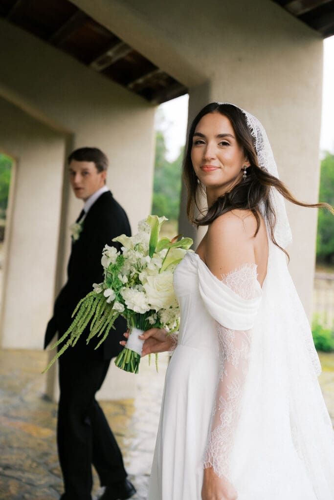 Bride and groom romantic rainy day wedding portraits at Chapel Dulcinea Austin Texas