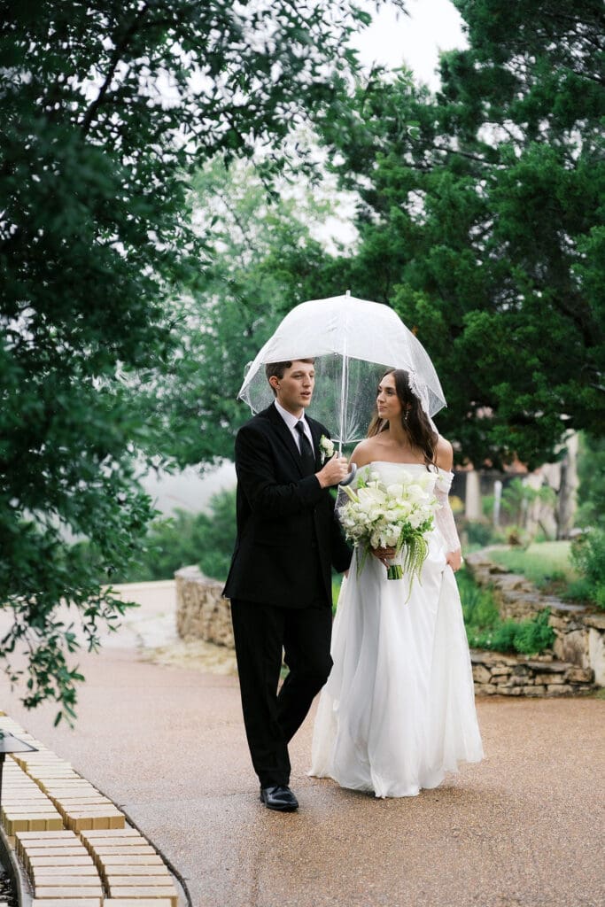 Bride and groom romantic rainy day wedding portraits at Chapel Dulcinea Austin Texas