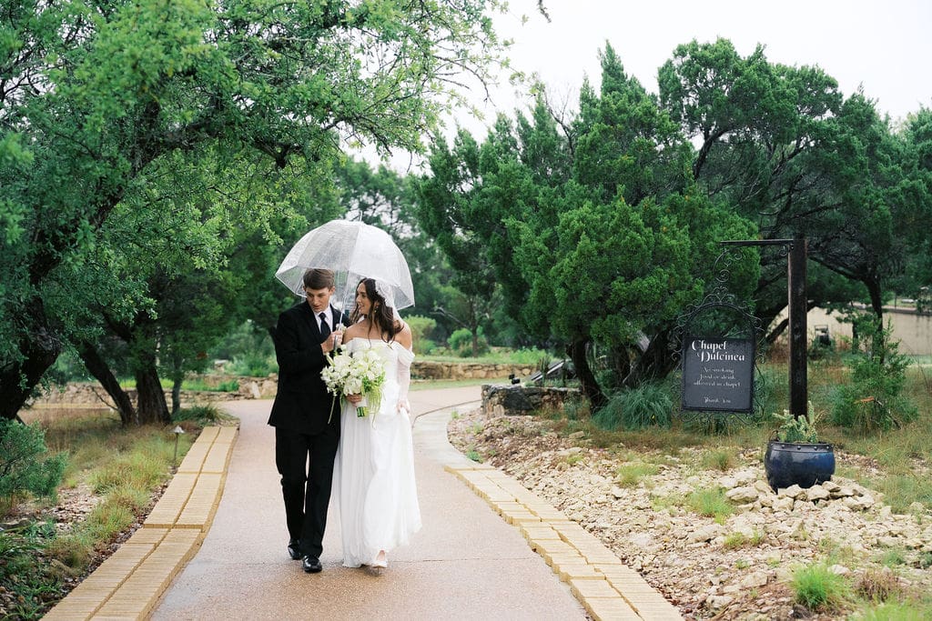 Bride and groom romantic rainy day wedding portraits at Chapel Dulcinea Austin Texas
