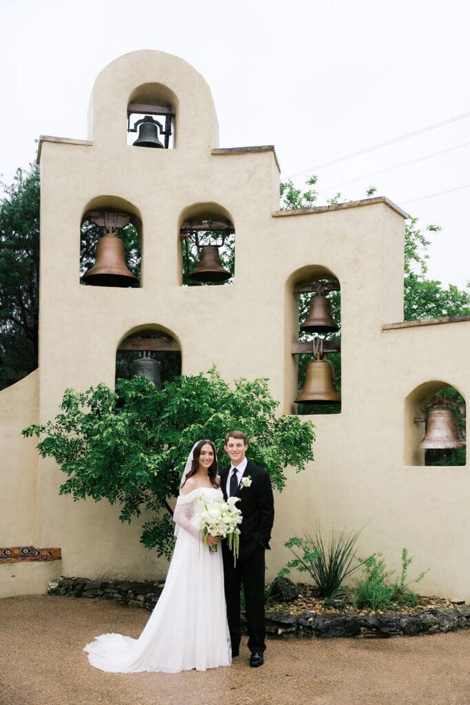 Bride and groom romantic rainy day wedding portraits at Chapel Dulcinea Austin Texas
