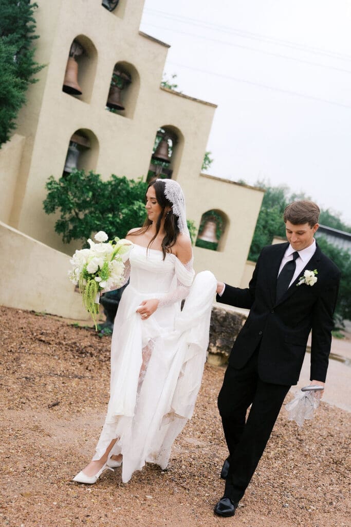 Bride and groom romantic rainy day wedding portraits at Chapel Dulcinea Austin Texas