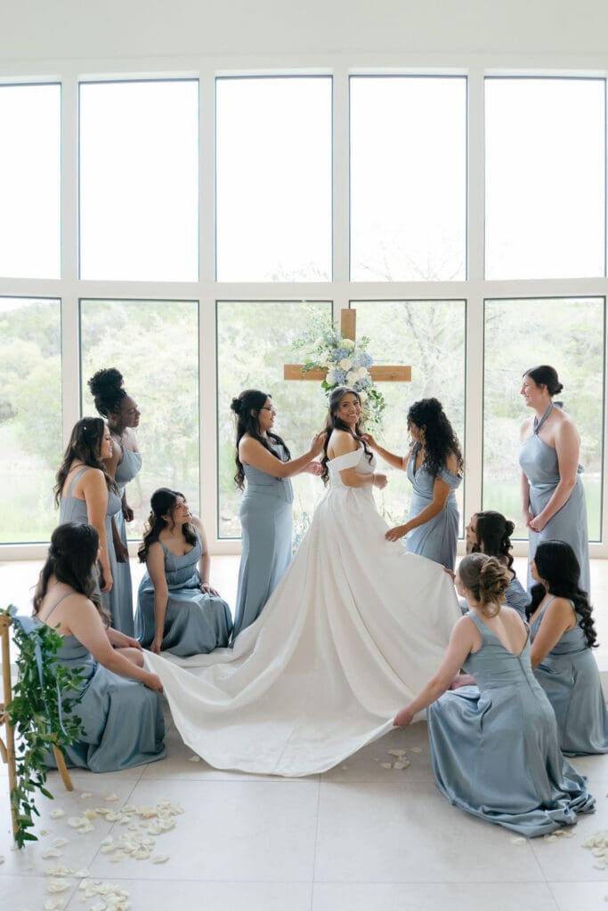 Bridesmaids helping bride get ready at The Preserve at Canyon Lake Texas Hill Country wedding