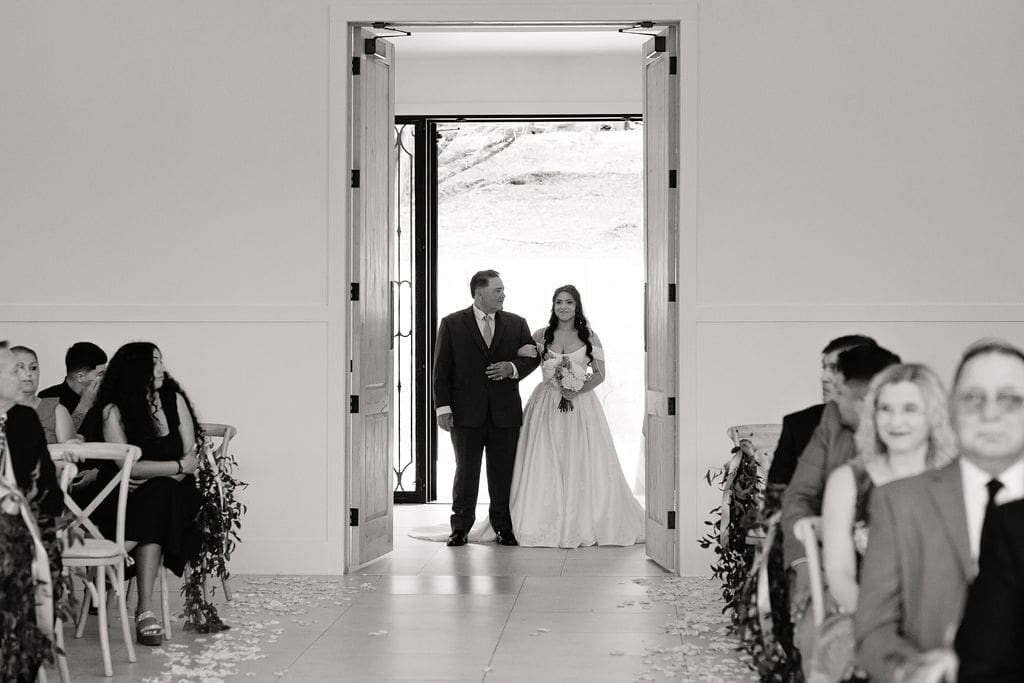 Bride walking down the aisle at The Preserve at Canyon Lake chapel Texas Hill Country