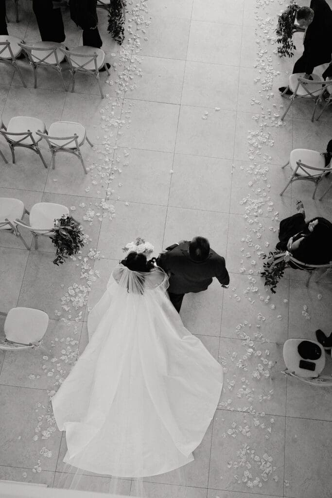 Bride walking down the aisle at The Preserve at Canyon Lake chapel Texas Hill Country