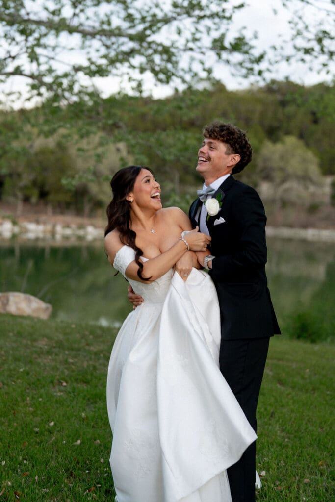 Bride and groom laughing during portraits at The Preserve at Canyon Lake Texas Hill Country