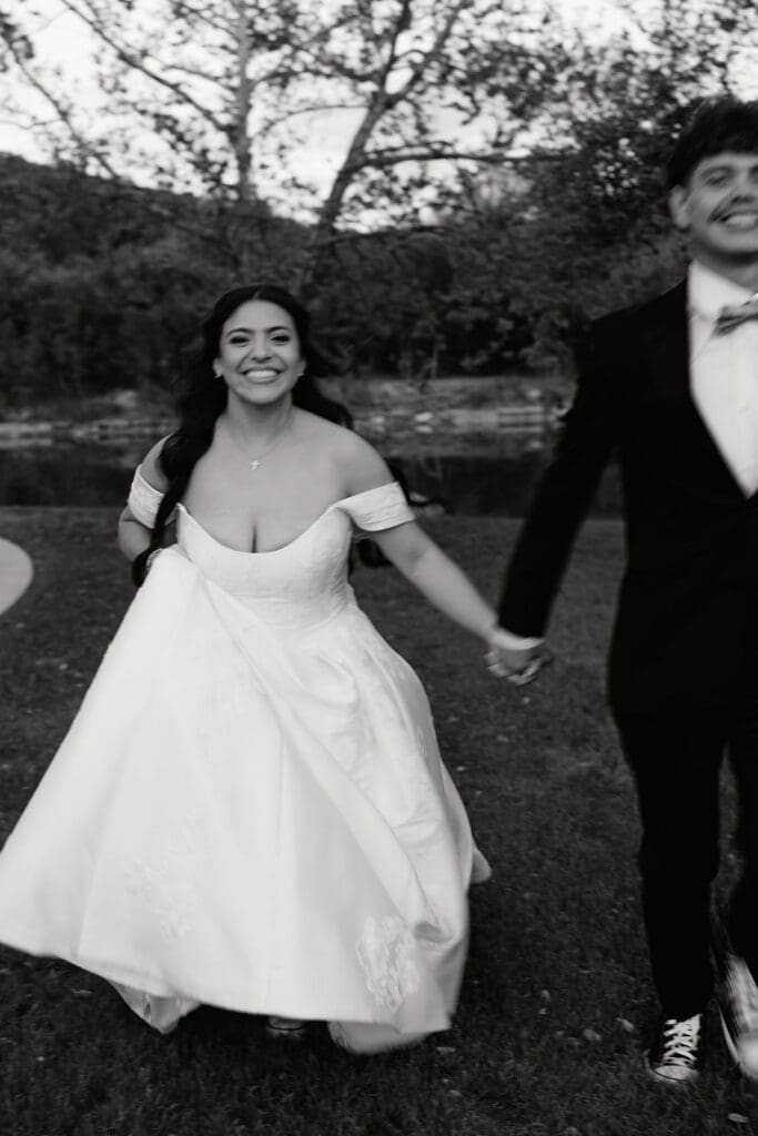 Bride and groom laughing during portraits at The Preserve at Canyon Lake Texas Hill Country
