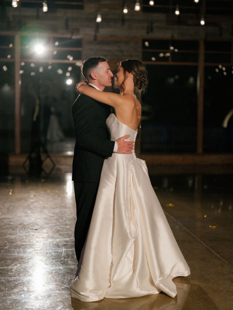 Newlyweds dancing together at their Texas Hill Country wedding reception