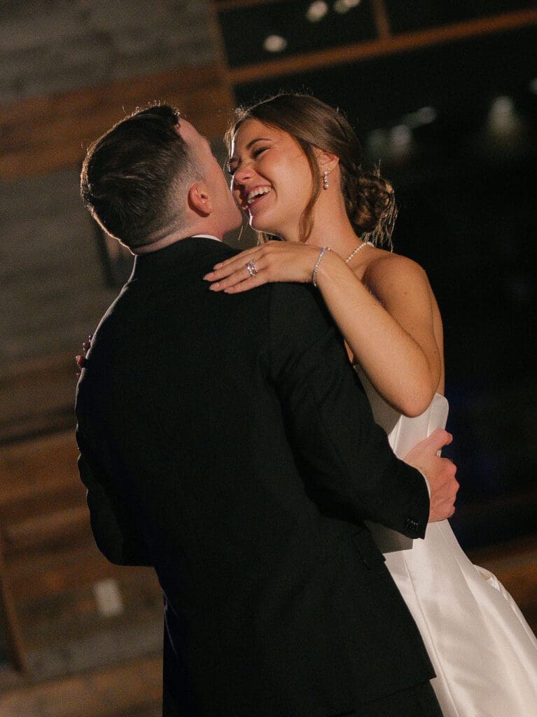 Newlyweds dancing together at their Texas Hill Country wedding reception