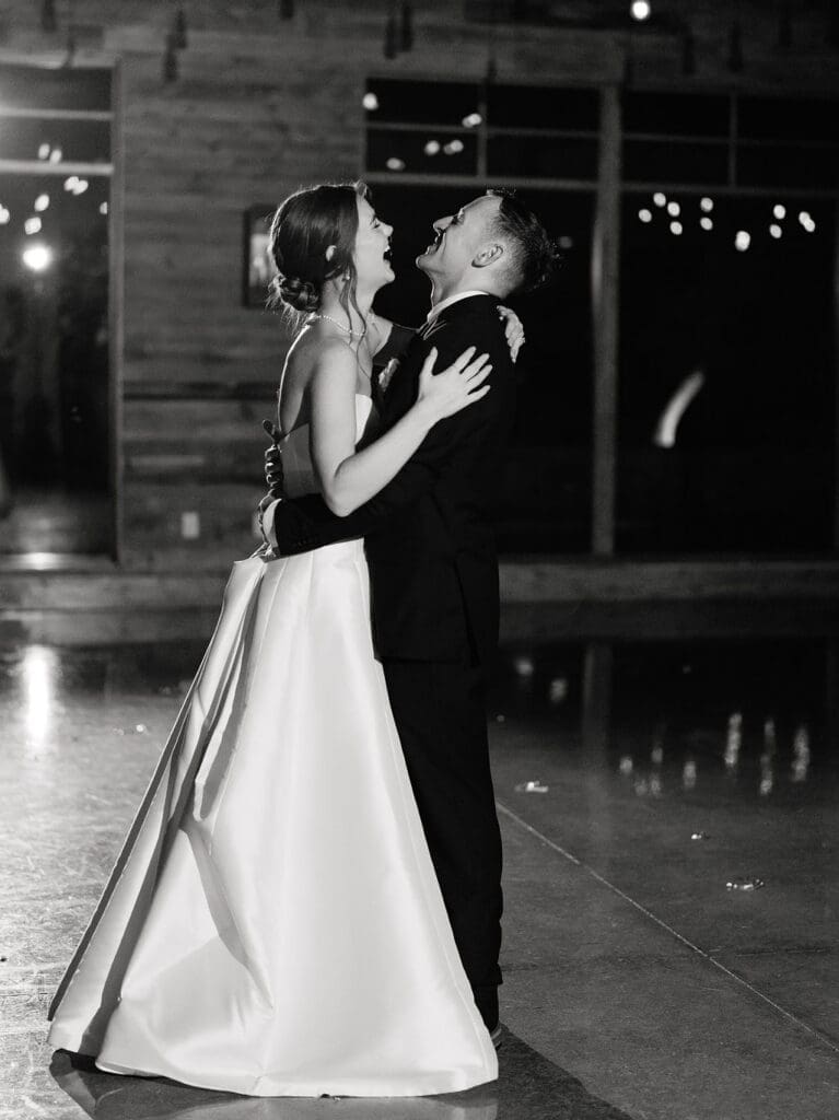 Newlyweds dancing together at their Texas Hill Country wedding reception