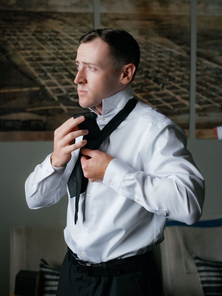 Groom getting ready calmly before his Canyonwood Ridge wedding
