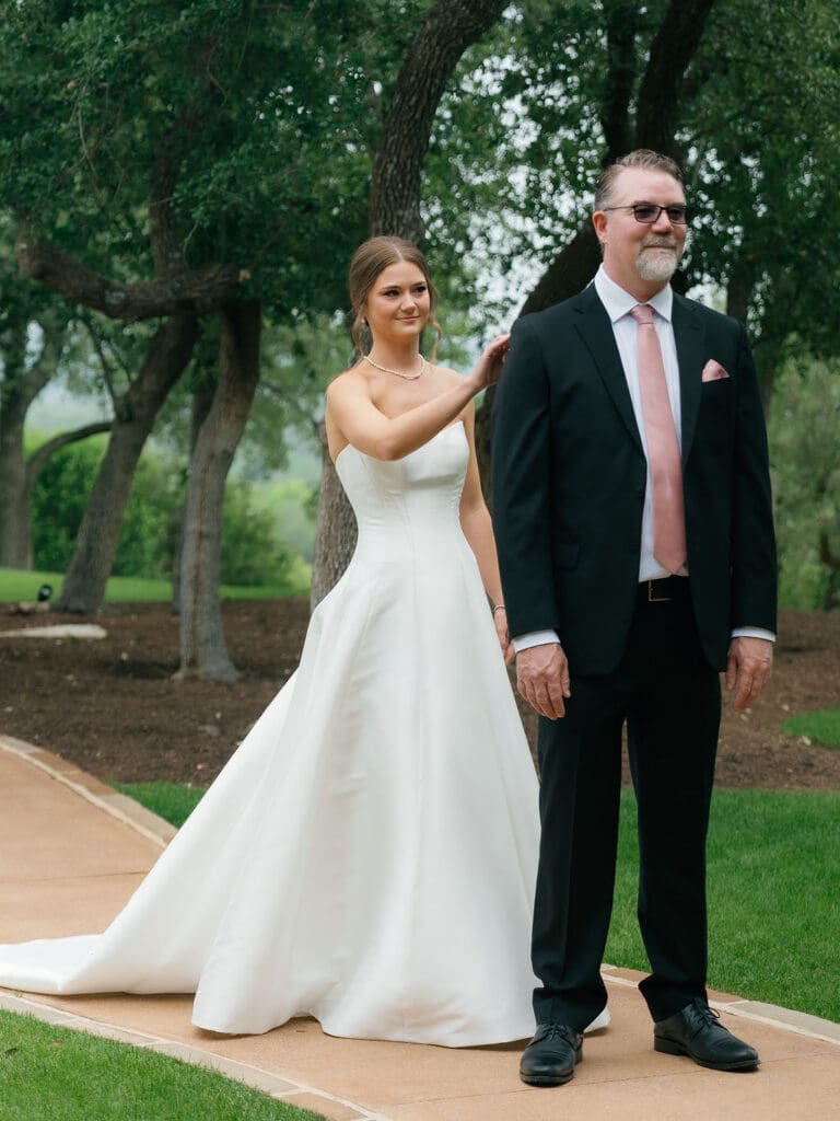 Bride sharing a first look with her father before Canyonwood Ridge wedding ceremony