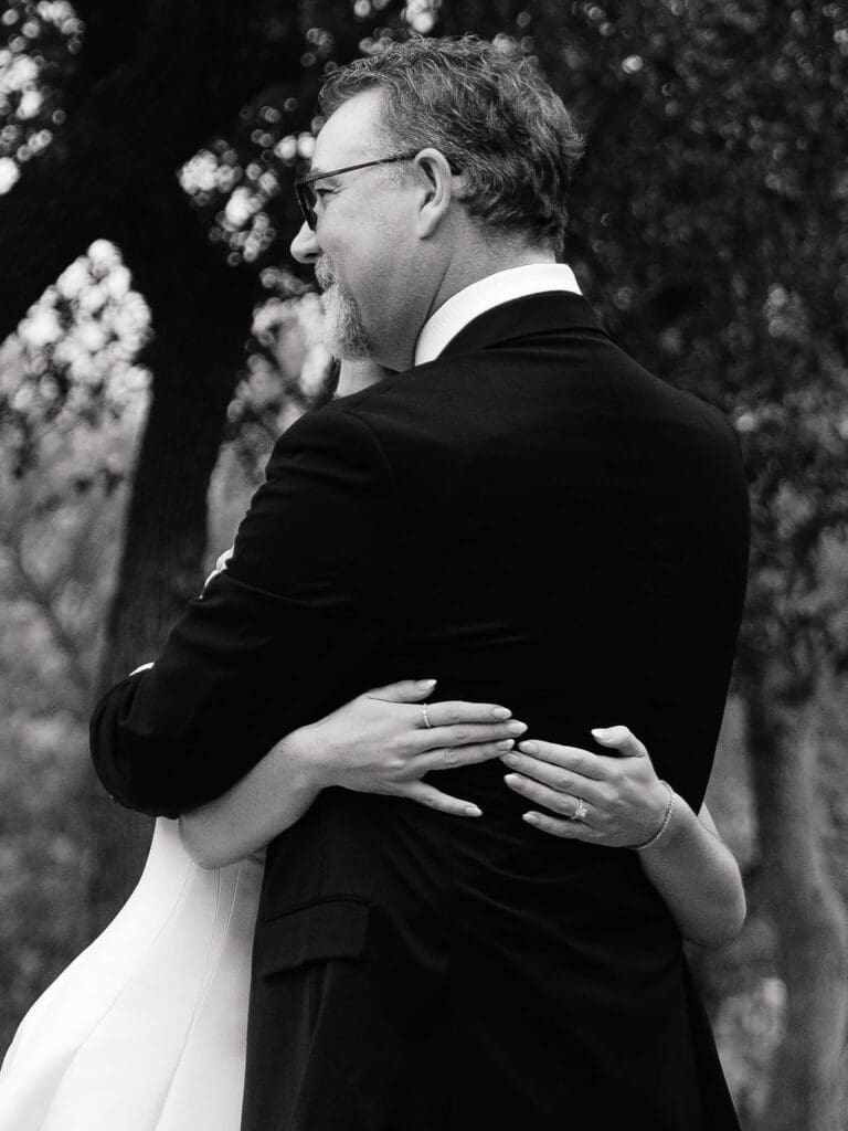 Bride sharing a first look with her father before Canyonwood Ridge wedding ceremony