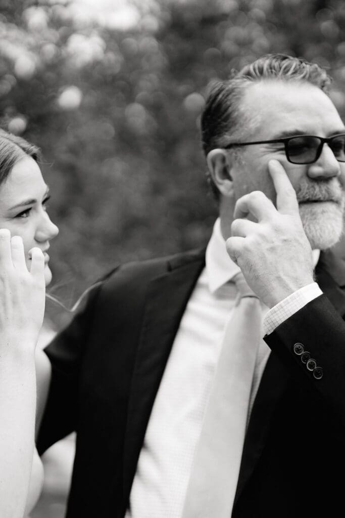 Father reacting emotionally to seeing his daughter in her wedding dress