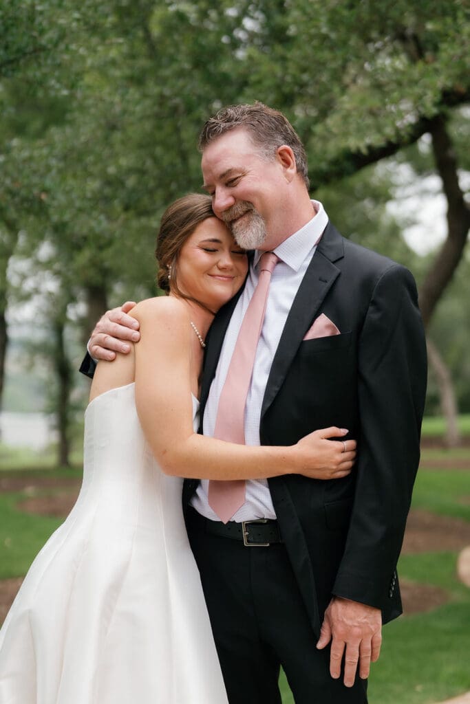 Father reacting emotionally to seeing his daughter in her wedding dress