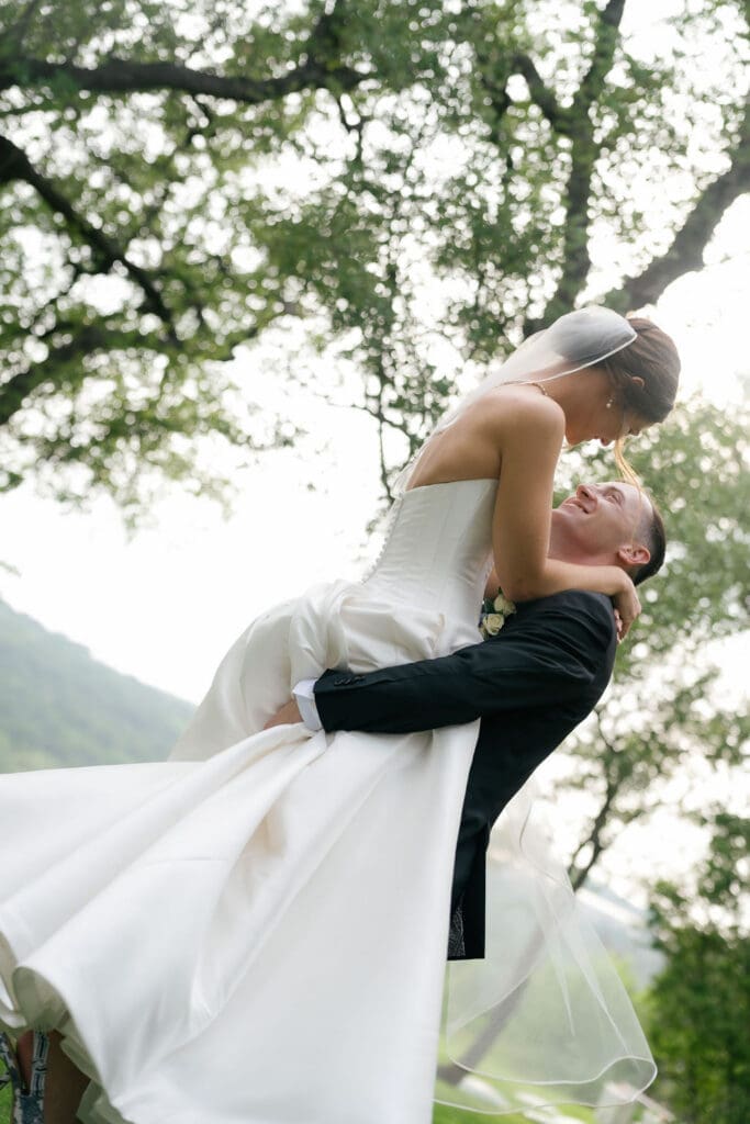 Romantic portrait of bride and groom with Canyonwood Ridge hills in the background