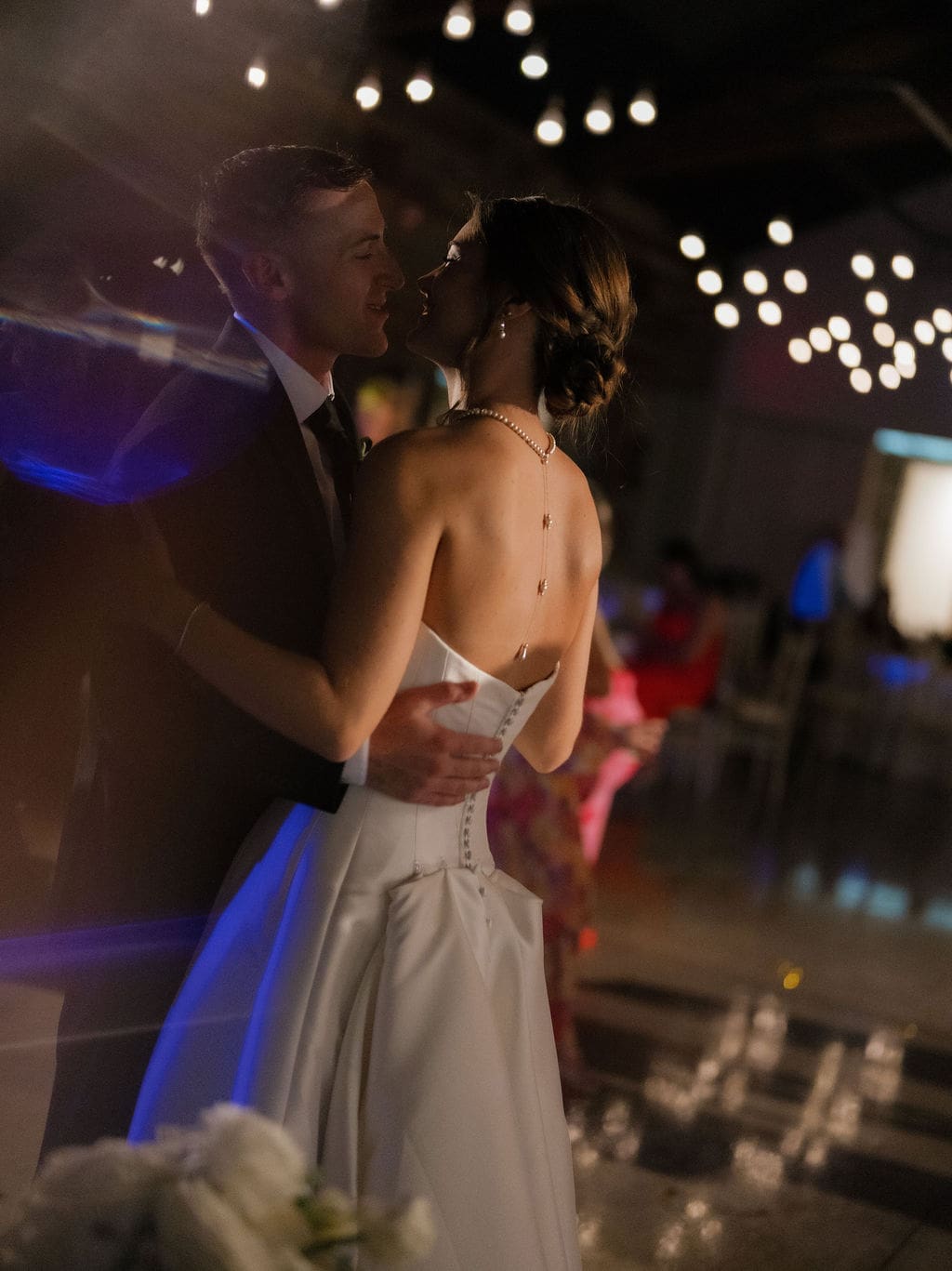 Newlyweds dancing together at their Texas Hill Country wedding reception