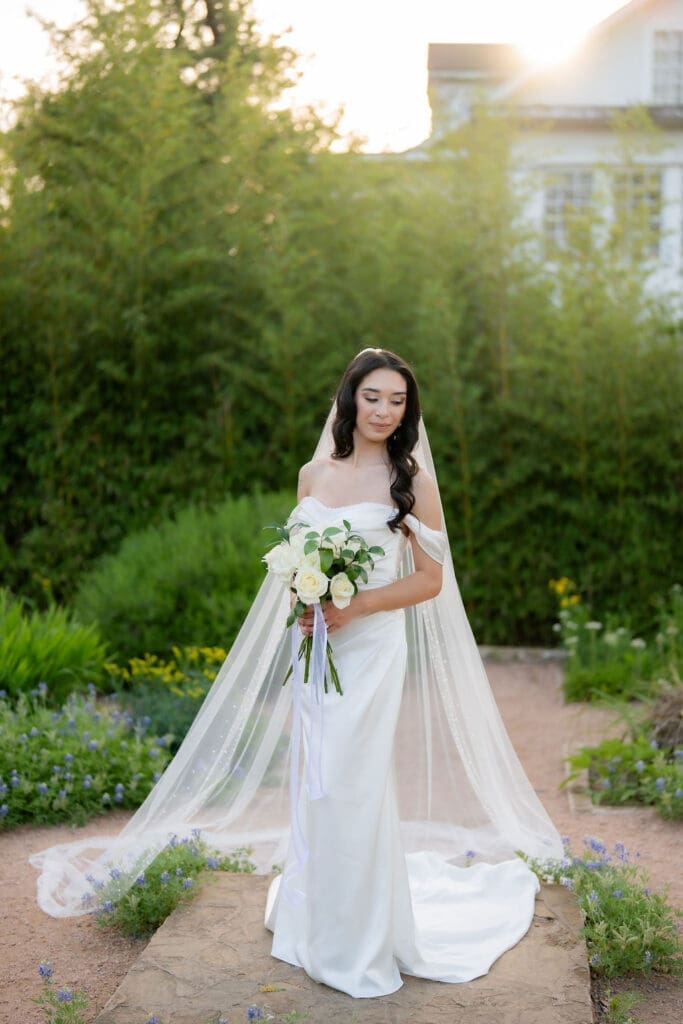 Bride in a white wedding gown standing at Landa Library in San Antonio Texas