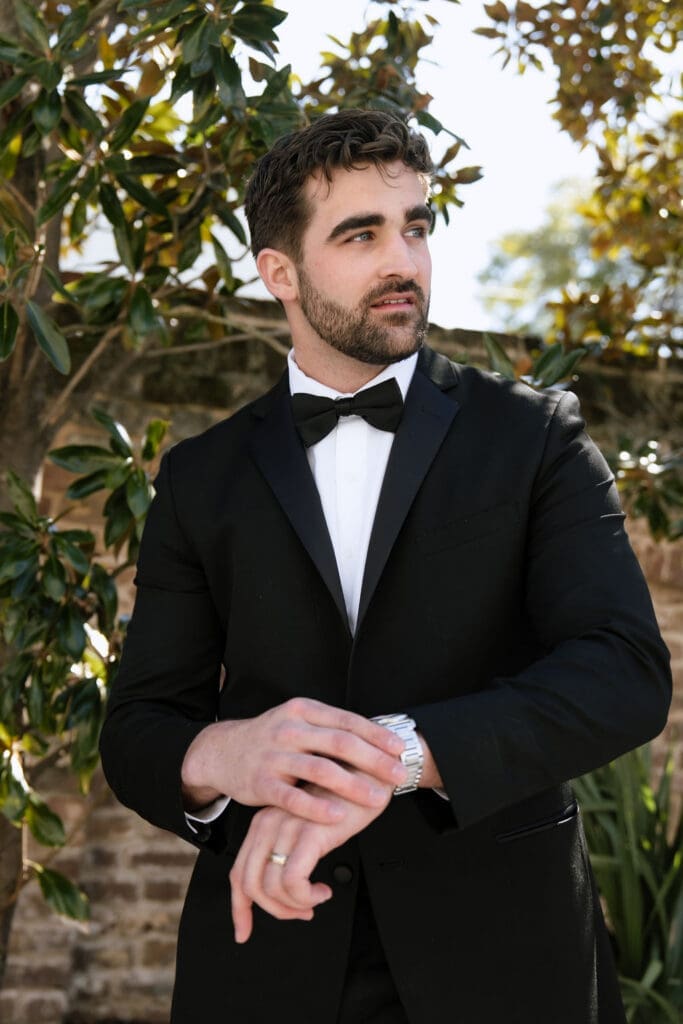 Charleston romance editorial groom in tailored suit at The Gadsden House by Andrea Jang Photography