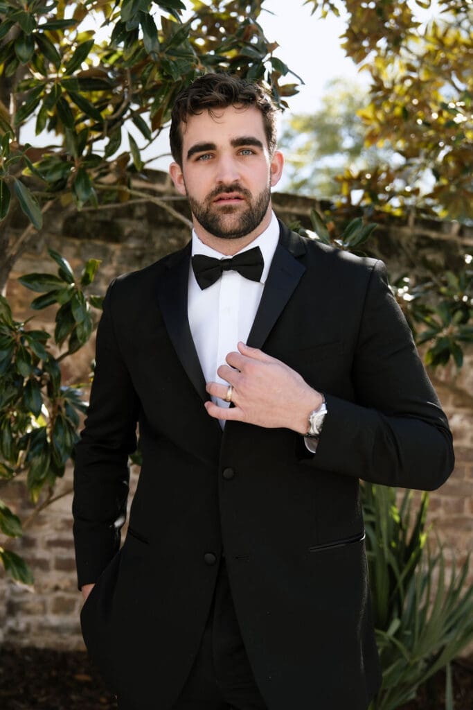 Charleston romance editorial groom in tailored suit at The Gadsden House by Andrea Jang Photography