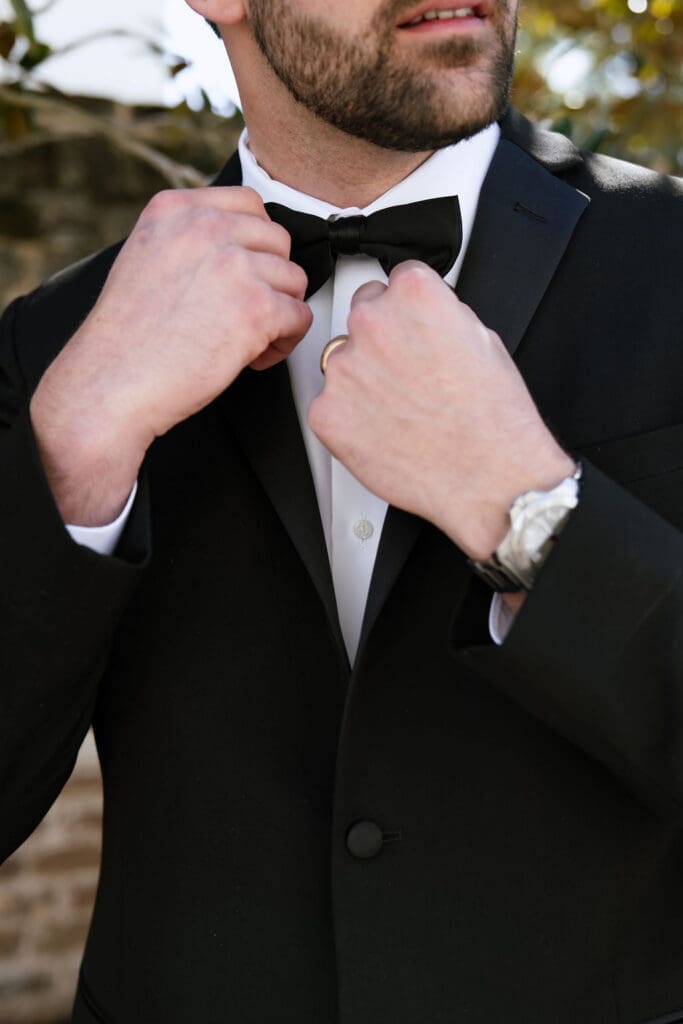 Charleston romance editorial groom in tailored suit at The Gadsden House by Andrea Jang Photography