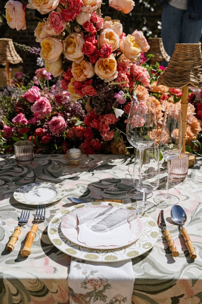 Outdoor wedding tablescape with botanical linen and colorful florals at The Gadsden House Charleston South Carolina