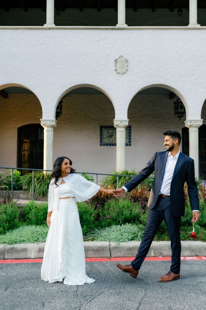 couple walking hand in hand along a garden path San Antonio Texas