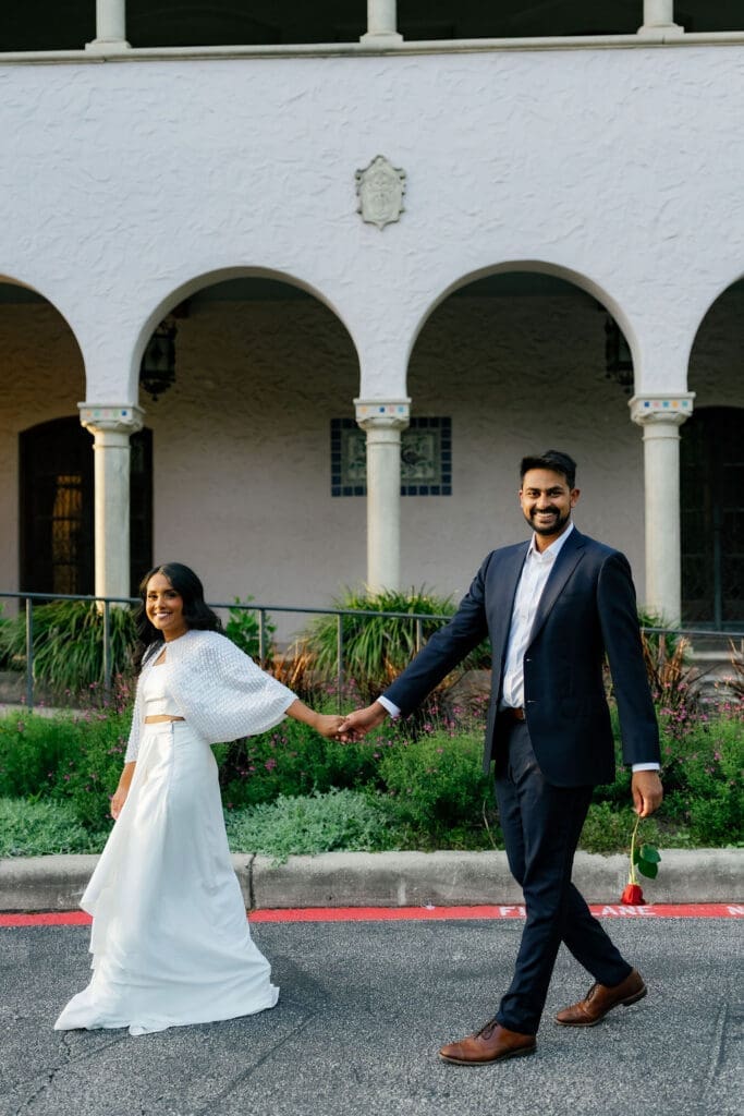 couple walking hand in hand along a garden path San Antonio Texas