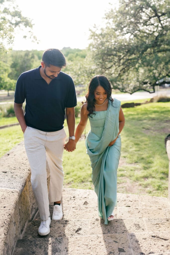 couple walking hand in hand along a garden path San Antonio Texas