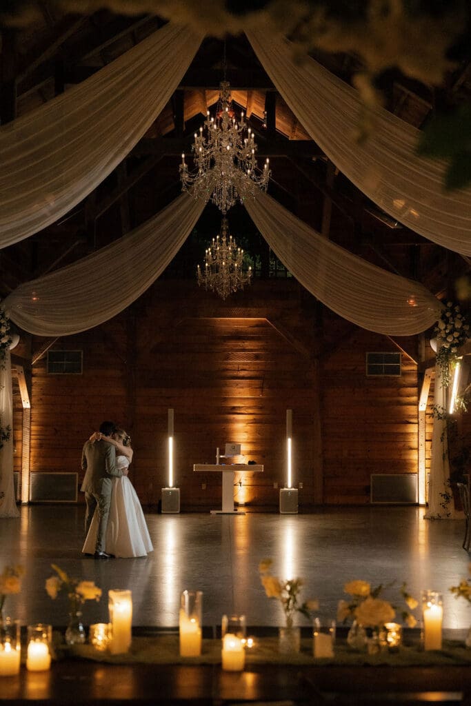 Newlyweds slow dancing at the end of their Addison Grove wedding reception