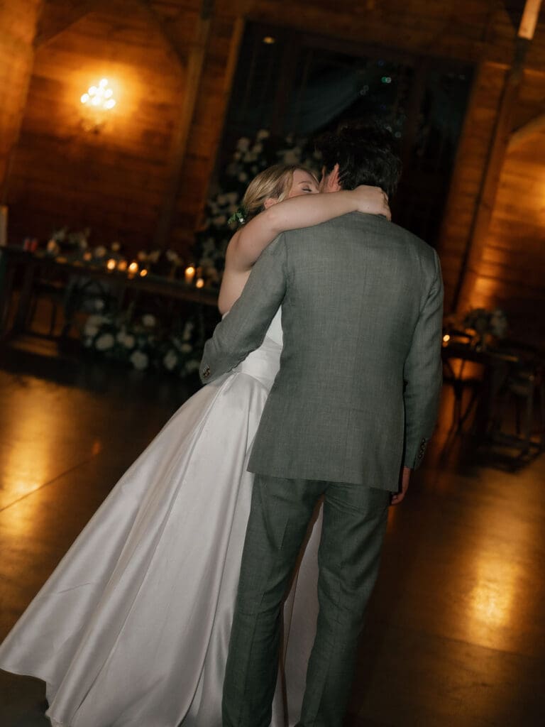 Newlyweds slow dancing at the end of their Addison Grove wedding reception