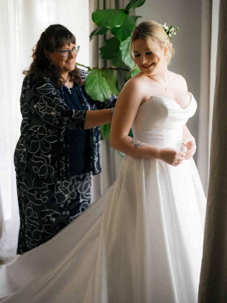 Mother helping Dana get ready in a bright, cheerful room