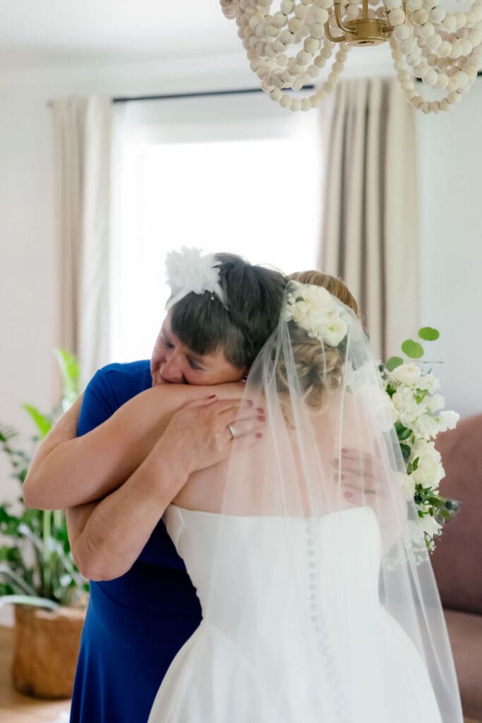 Bride and her grandmother sharing a hug at an Addison Grove wedding
