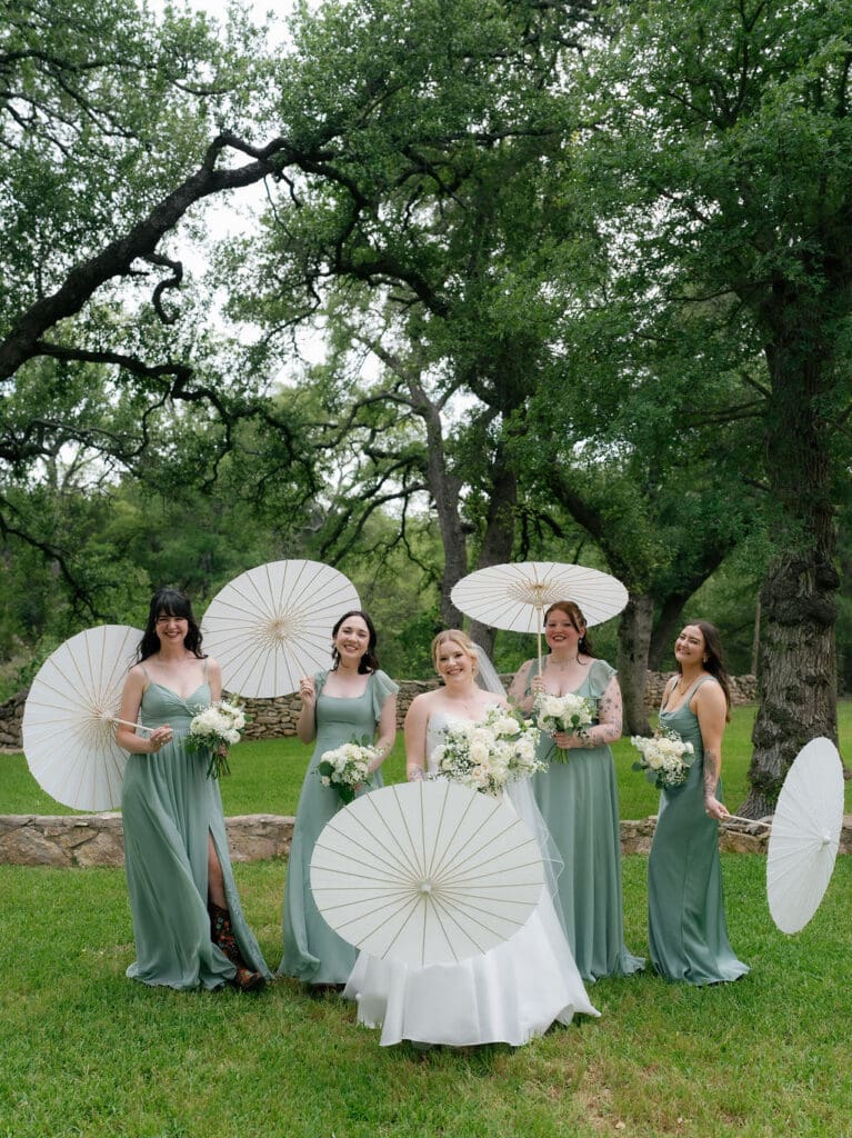 Bridesmaids gathered around Dana in her wedding gown